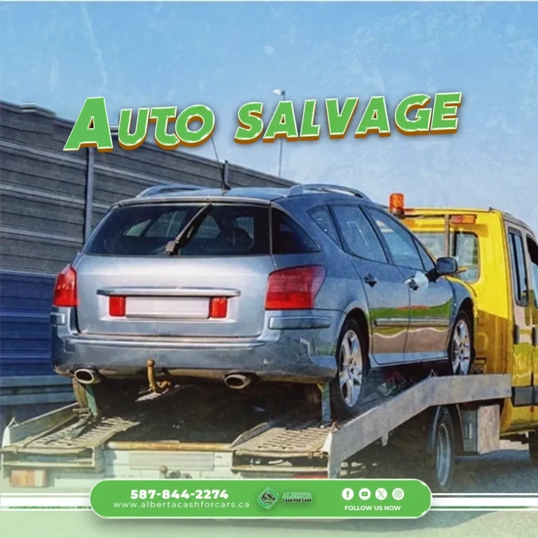 Auto Salvage text above a gray station wagon on the back of a yellow tow truck.