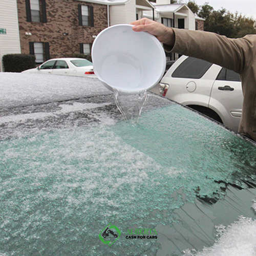 Can you deice windshield with warm water?