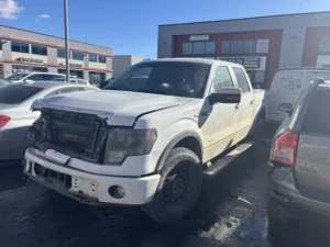 Alberta Cash for Cars tow truck picking up a truck in Calgary 