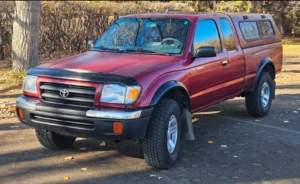 Red Toyota Tacoma Located in the forests of Red Deer