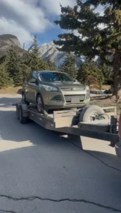 a Ford Escape in a road on Banff