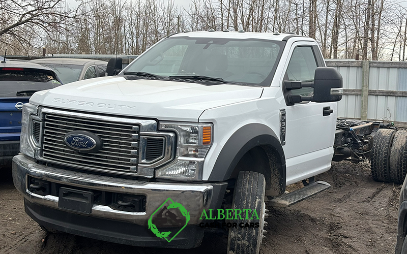 a ford truck in a scrap yard