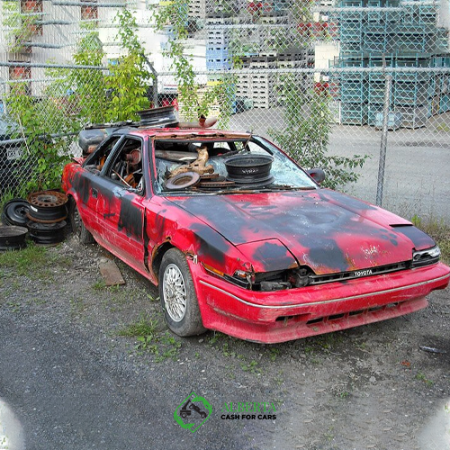 broken car in a yard