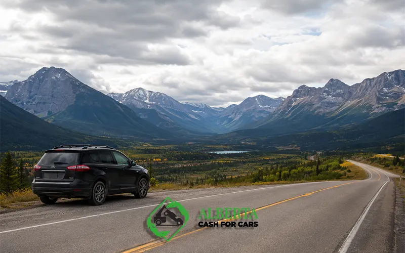 Black SUV parked on the shoulder of a scenic mountain road